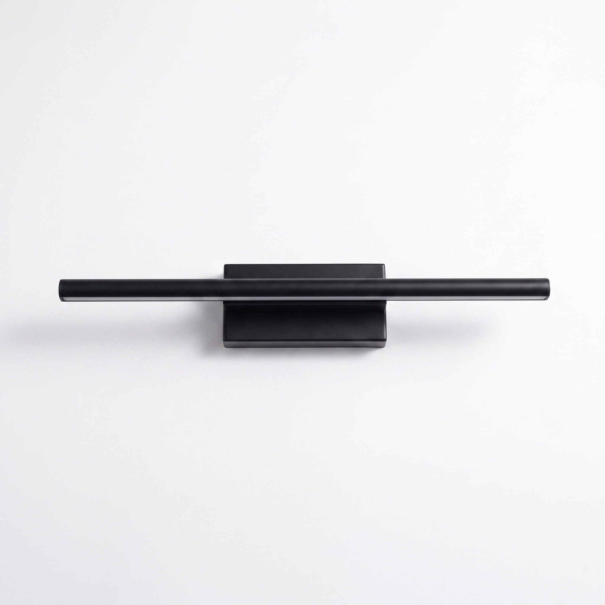 Black wall sconce on a plain white background
