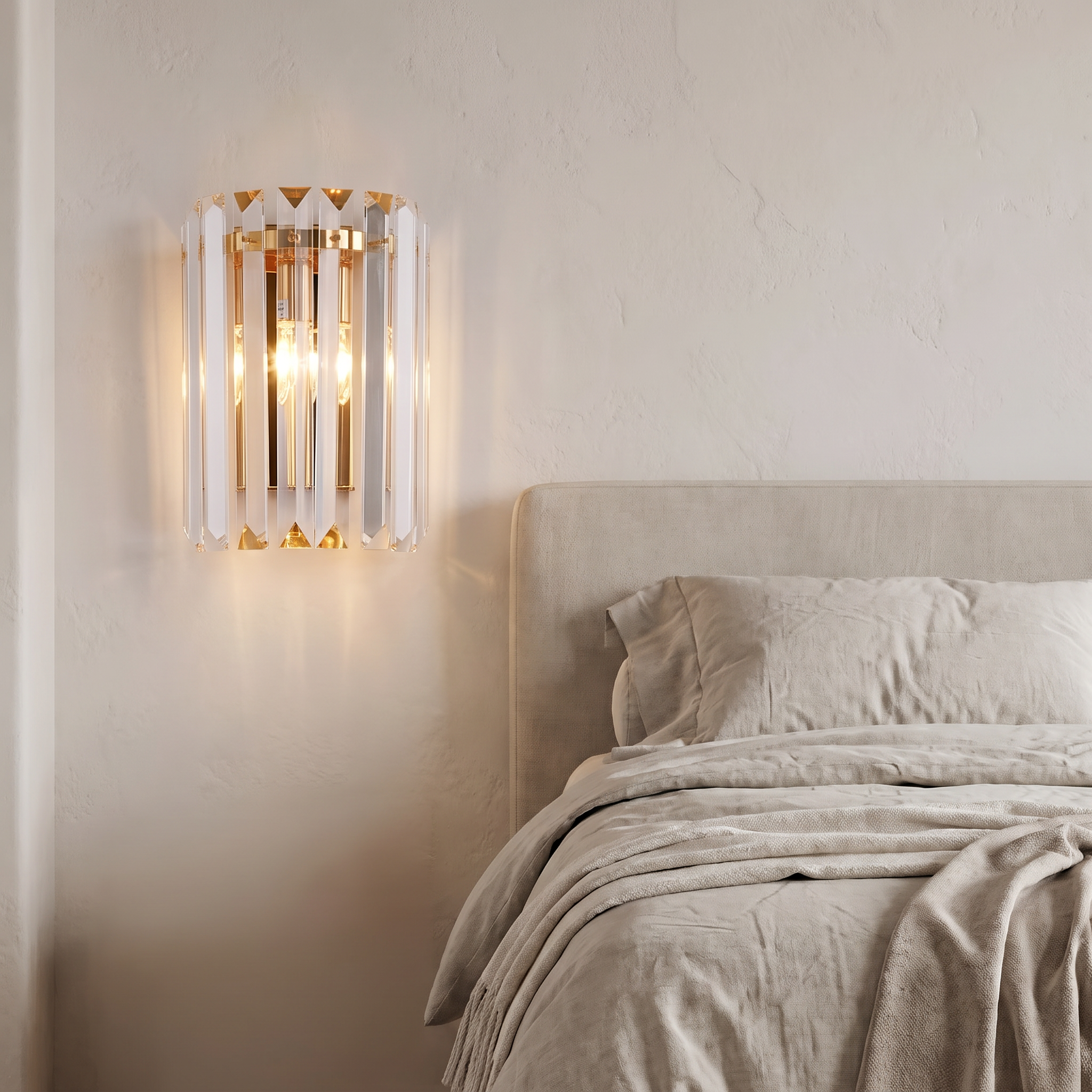 Crystal wall light beside a bed in a modern bedroom