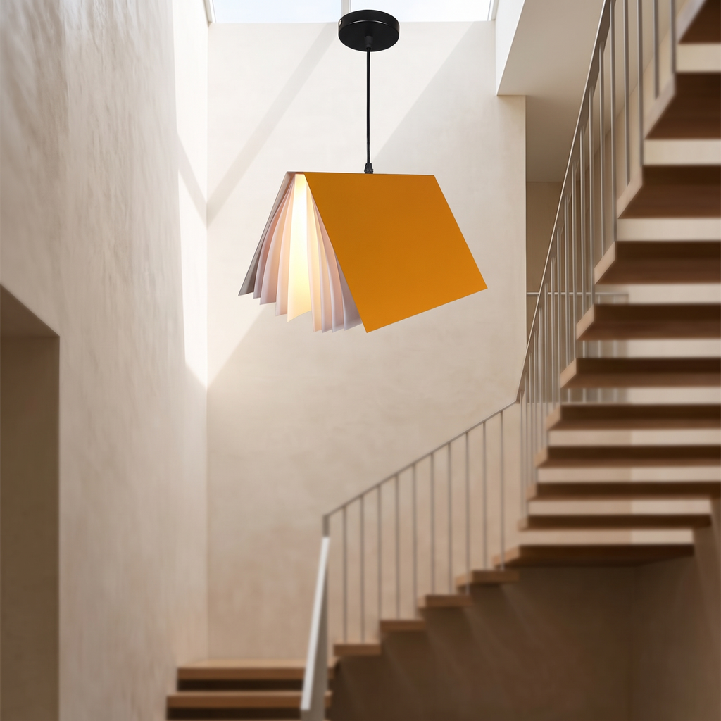 Flying book pendant light hanging in a stairwell
