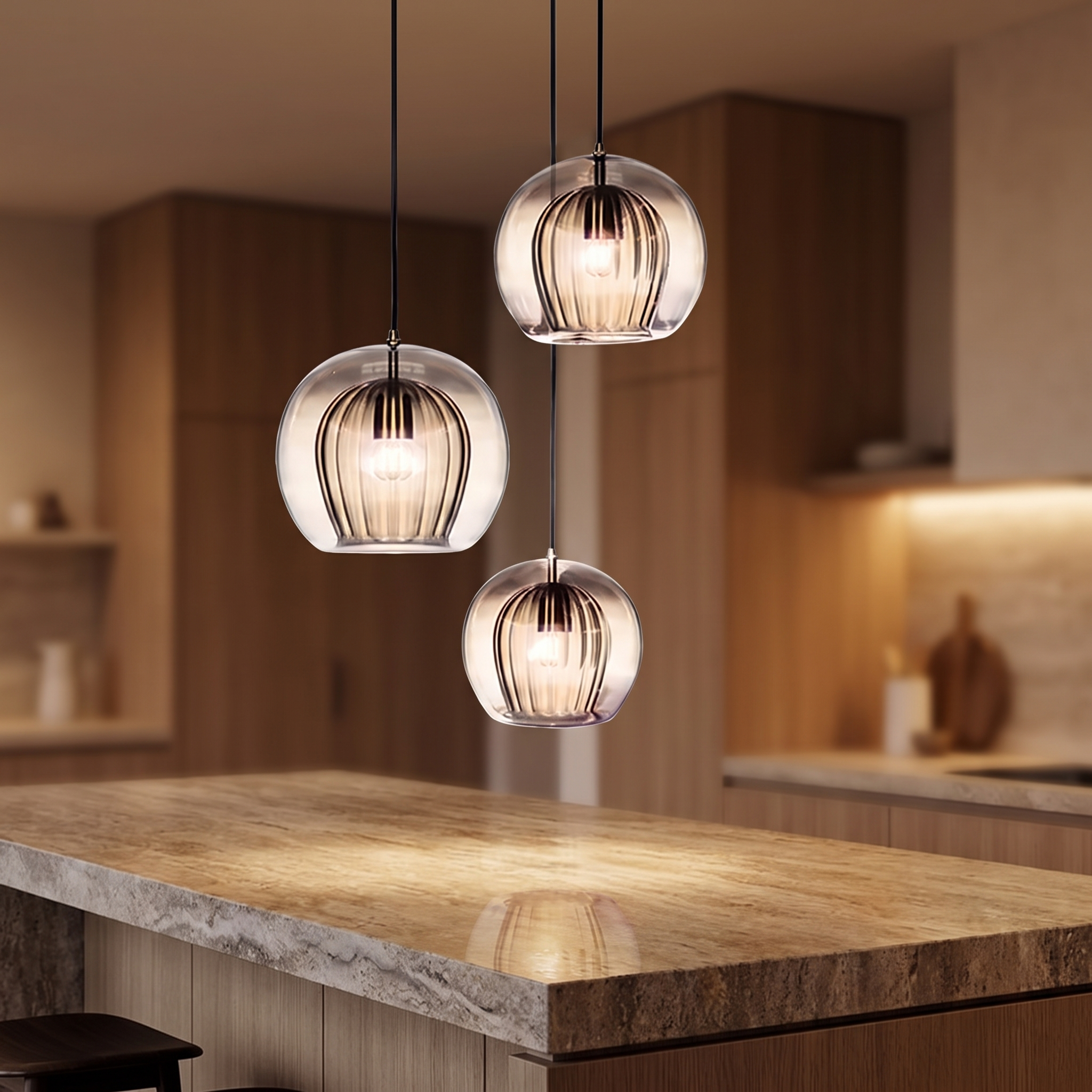 Glass pendant light above a kitchen island