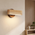 Rotating wood and aluminium wall lamp in a Japanese-inspired interior