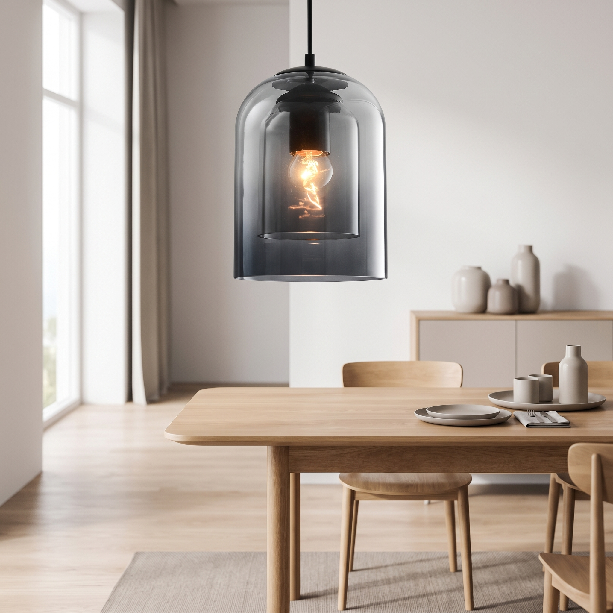 Glass pendant light above a dining table in a Scandinavian room