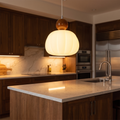 Acrylic pendant lamp above a kitchen island