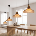 Ribbed glass pendant lamp above a dining table