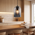 Double glass shade pendant lamp above a breakfast bar