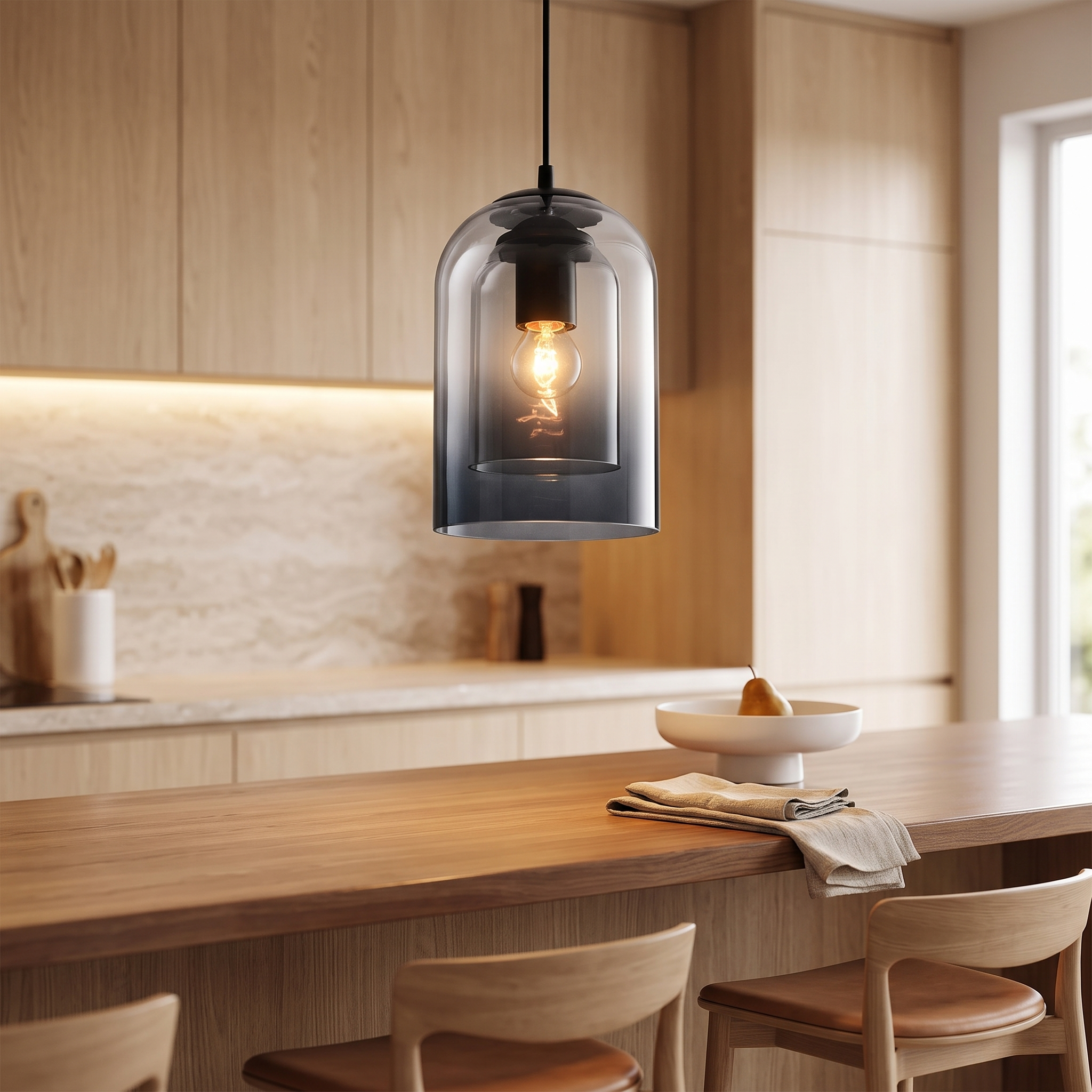 Double glass shade pendant lamp above a breakfast bar