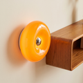 Bauhaus donut LED light on a mid-century interior wall