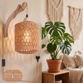 Hand-woven rattan wall lamp in a boho bedroom