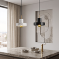 Natural marble pendant lamp above a stone counter