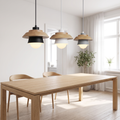 Nordic wood macaron pendant light above a timber dining table