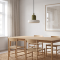 Minimal Scandinavian pendant light above an oak dining table