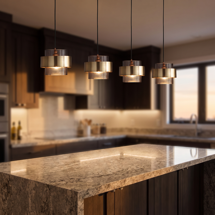Nordic glass and brass cylinder pendant above a kitchen island